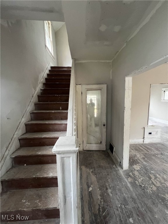 stairs with wood-type flooring