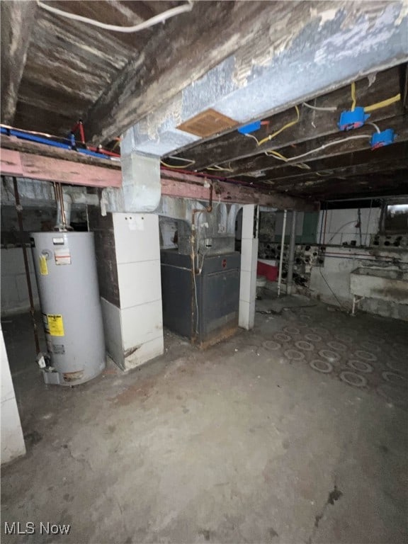 basement with gas water heater and heating unit