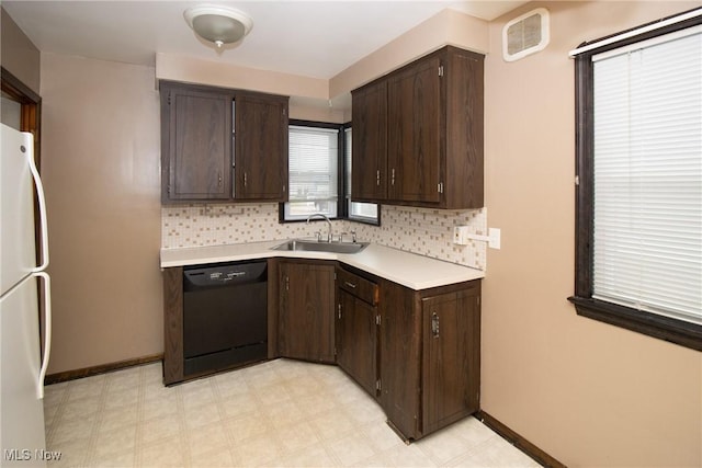 kitchen with dishwasher, sink, dark brown cabinets, and white refrigerator