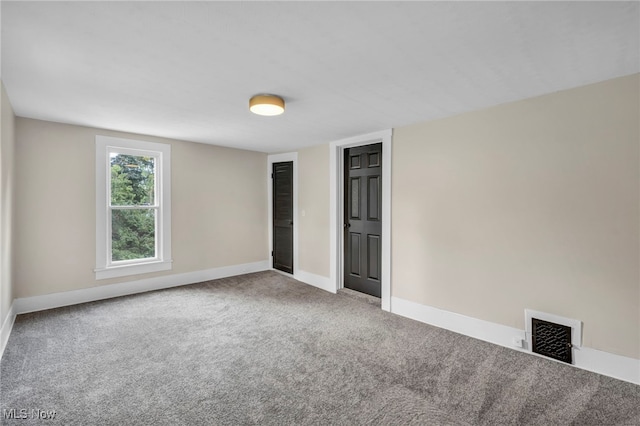 unfurnished room with carpet