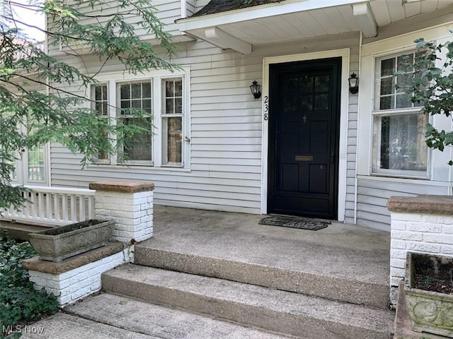 property entrance featuring covered porch