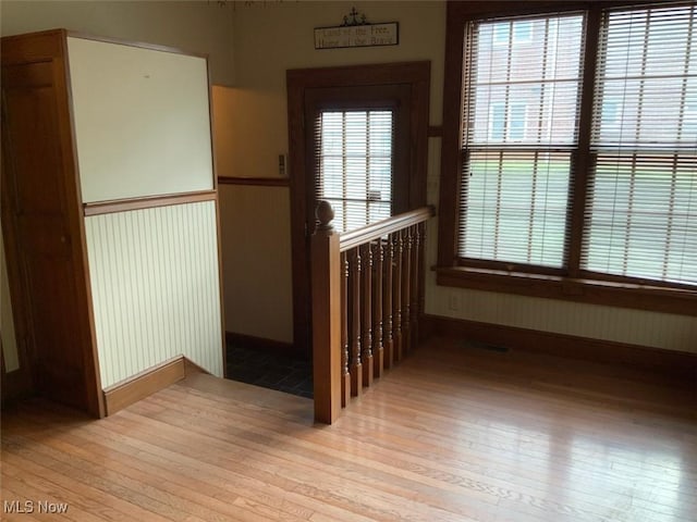 stairs with hardwood / wood-style flooring