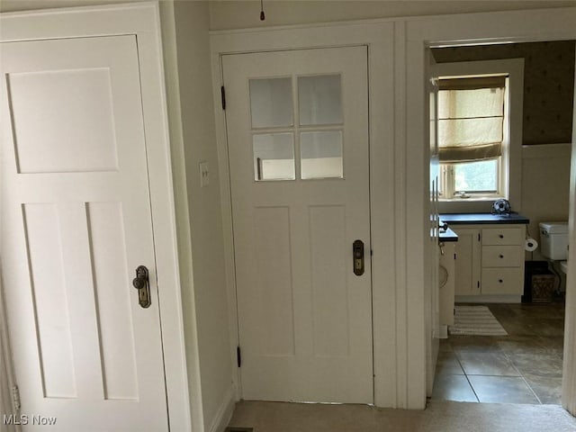 entryway featuring tile patterned flooring