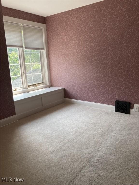 view of carpeted spare room