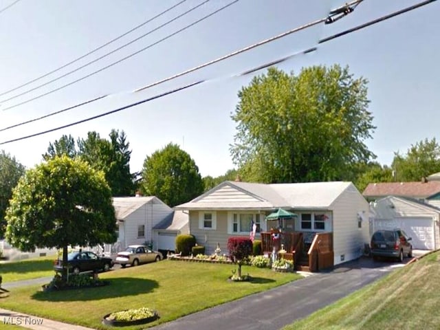 single story home featuring a garage and a front yard