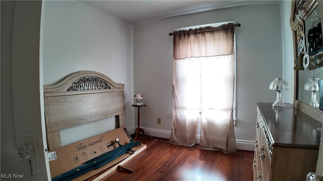 unfurnished bedroom with dark hardwood / wood-style floors