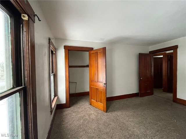 unfurnished bedroom with carpet