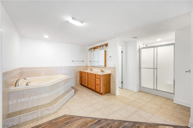 bathroom with separate shower and tub, tile patterned flooring, and vanity