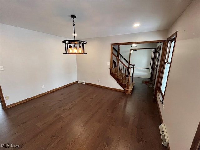 unfurnished dining area with dark hardwood / wood-style floors