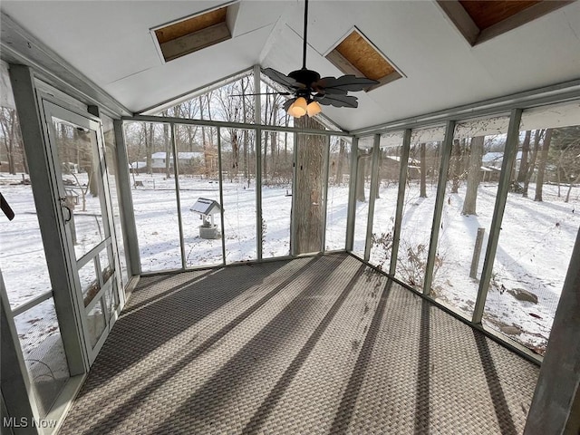 unfurnished sunroom featuring vaulted ceiling and ceiling fan