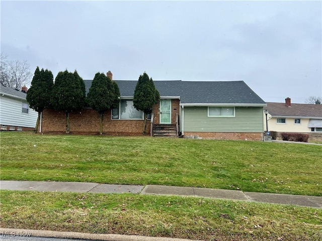 ranch-style home with a front yard