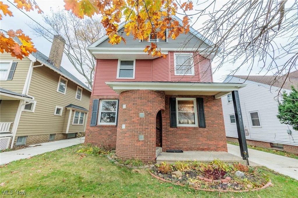 view of front of home with a front yard