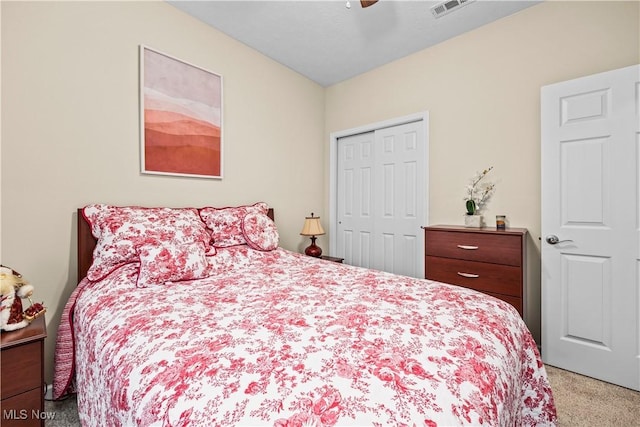 bedroom with carpet flooring, a closet, and ceiling fan