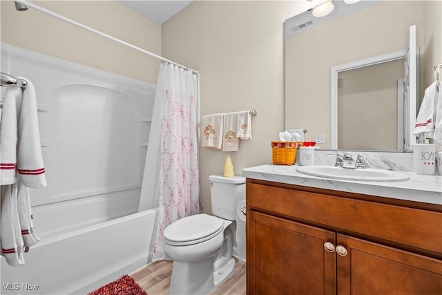 full bathroom with toilet, vanity, shower / bath combination with curtain, and hardwood / wood-style flooring