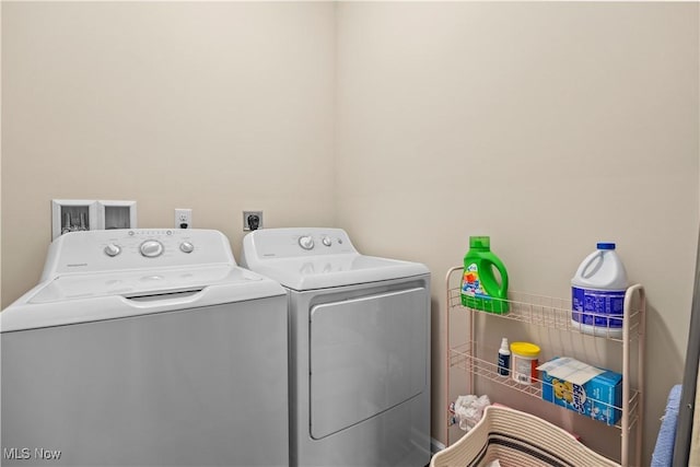 washroom with washer and clothes dryer