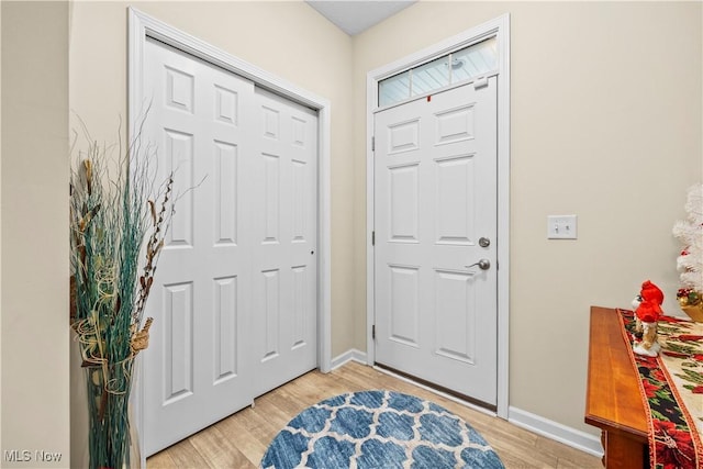 foyer entrance with light hardwood / wood-style flooring