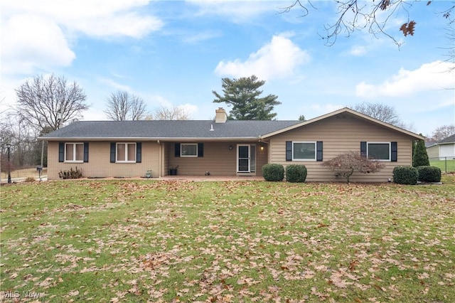 ranch-style home featuring a front yard