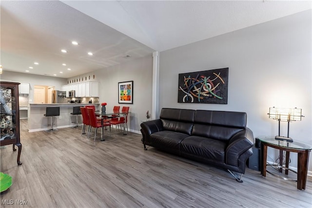 living room with light hardwood / wood-style floors