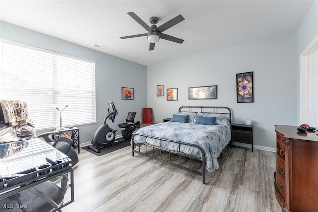 bedroom featuring ceiling fan and light wood-type flooring