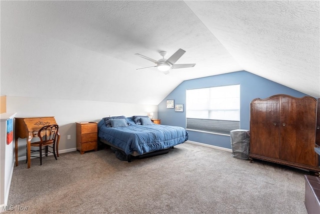 carpeted bedroom with ceiling fan, lofted ceiling, and a textured ceiling