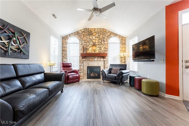 living room featuring plenty of natural light, hardwood / wood-style floors, and lofted ceiling