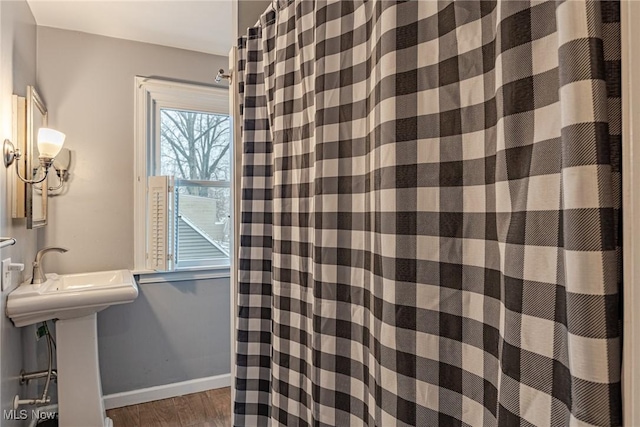 bathroom featuring sink and hardwood / wood-style flooring