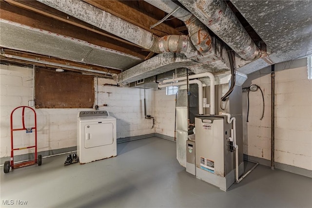 basement with washer / dryer and heating unit