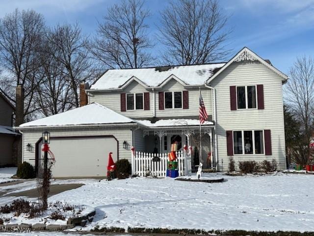 view of front of house featuring a porch and a garage