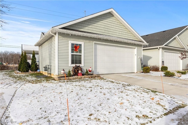 view of snow covered exterior with a garage