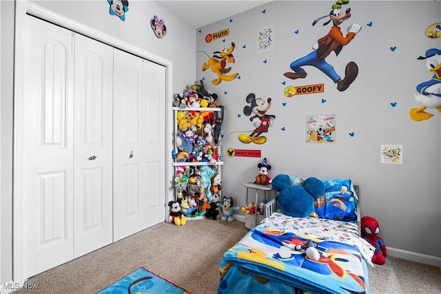 bedroom featuring a closet and carpet