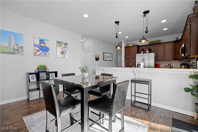 dining room featuring dark hardwood / wood-style floors