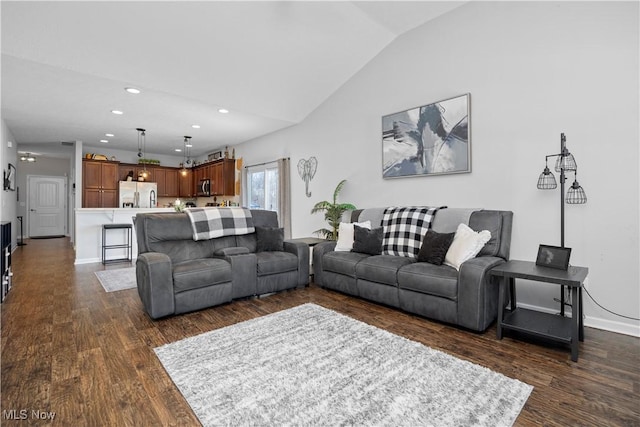 living room featuring vaulted ceiling and dark wood-type flooring