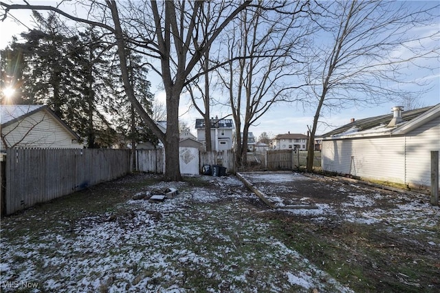 view of yard layered in snow