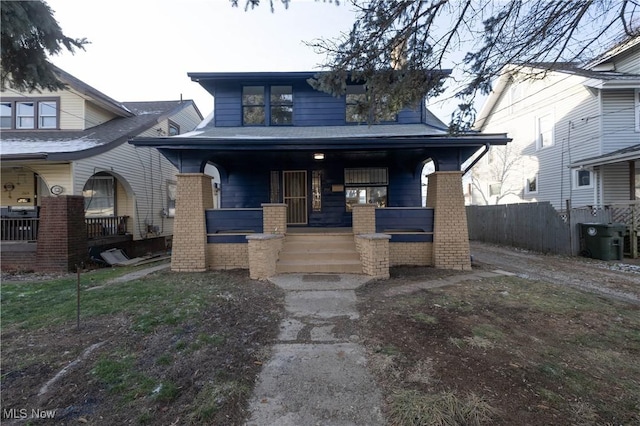 view of front facade featuring covered porch and central air condition unit