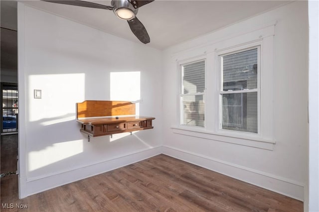 spare room featuring ceiling fan and hardwood / wood-style flooring