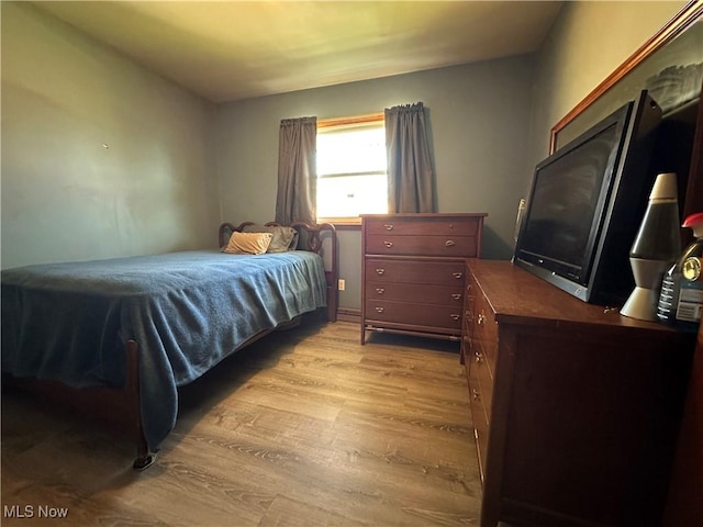 bedroom with light wood-type flooring