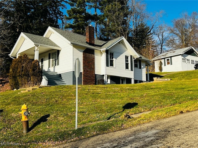 view of side of home featuring a yard