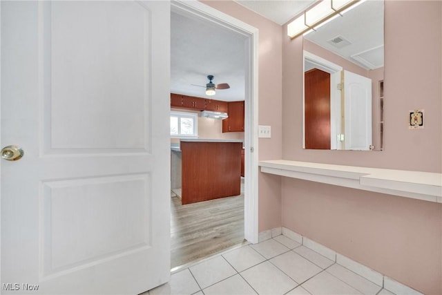 bathroom with visible vents, baseboards, a ceiling fan, and tile patterned flooring