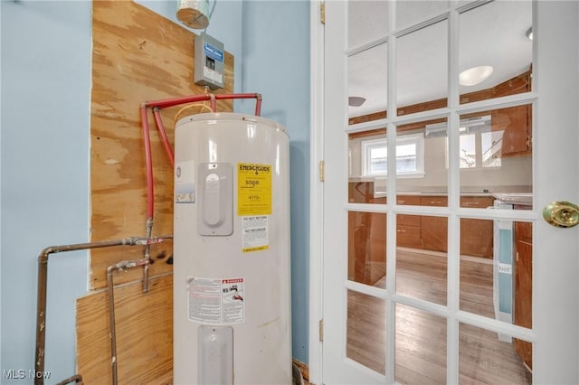 utility room with electric water heater