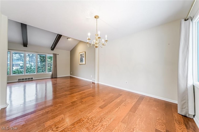 spare room with visible vents, baseboards, lofted ceiling with beams, light wood-style floors, and a notable chandelier