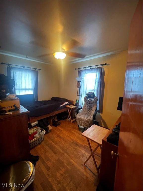 bedroom featuring ceiling fan and hardwood / wood-style floors