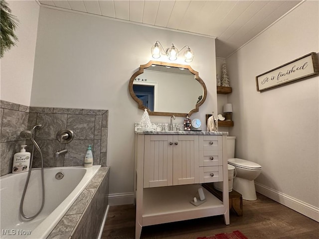 bathroom featuring a relaxing tiled tub, hardwood / wood-style floors, toilet, vanity, and wood ceiling