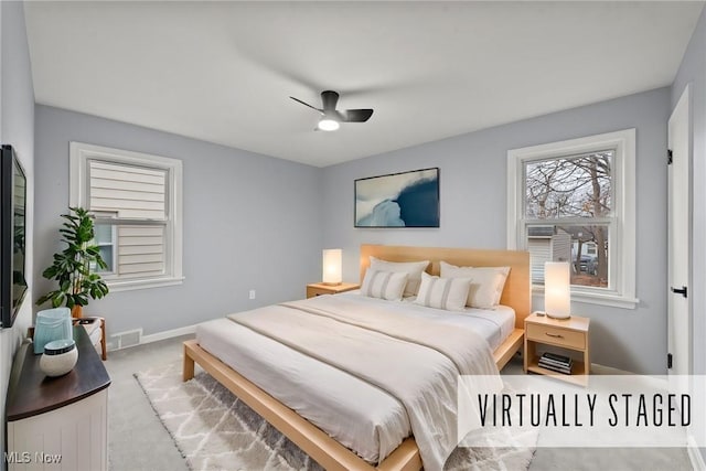 carpeted bedroom with ceiling fan