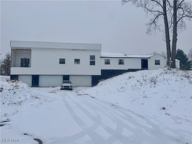 view of snow covered house