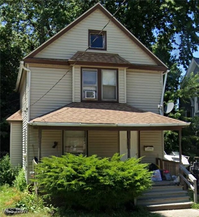 rear view of house with covered porch