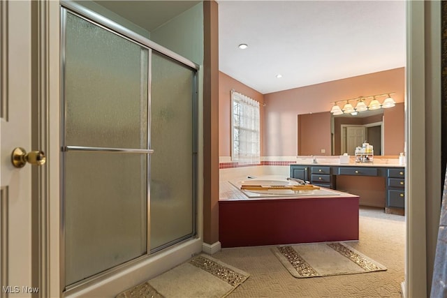 bathroom featuring vanity and a shower with shower door