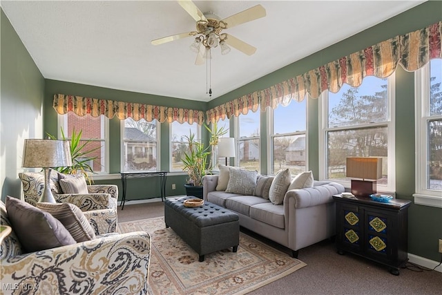 sunroom featuring ceiling fan