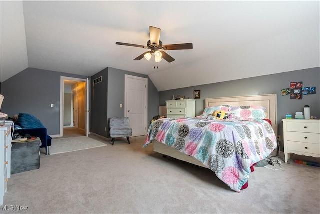 bedroom featuring ceiling fan, light colored carpet, and lofted ceiling