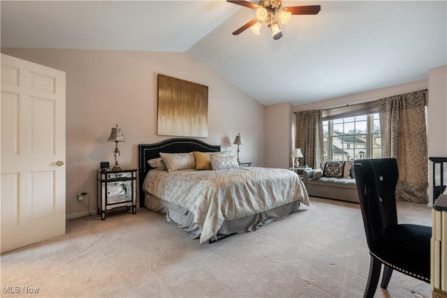 carpeted bedroom featuring ceiling fan and vaulted ceiling