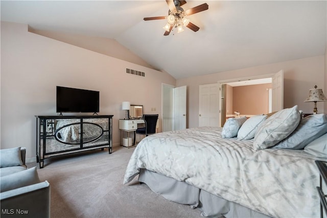 carpeted bedroom featuring ceiling fan and vaulted ceiling